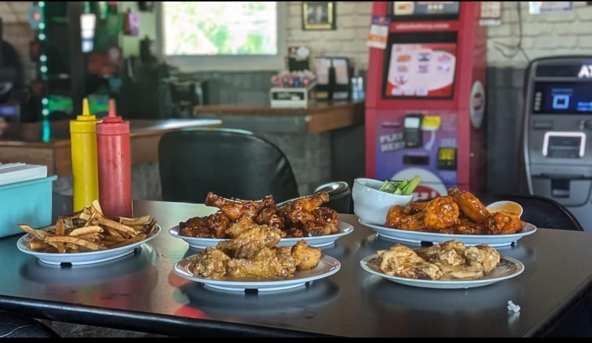 Spread of food and drinks across the bar